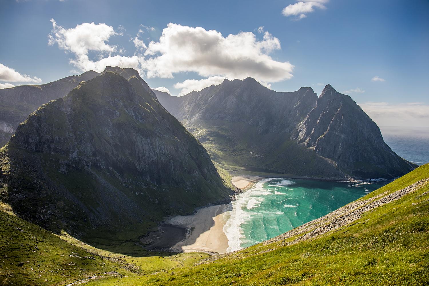 Kvalvika Beach seen from the Ryten trail, turquoise water in a bowl of mountains