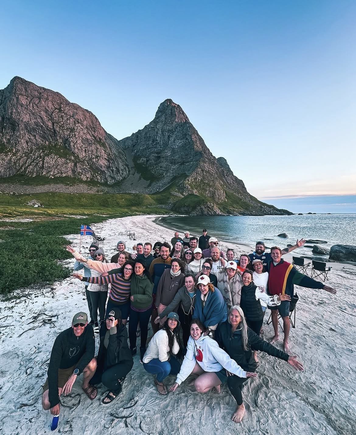 The whole group together on the beach in the evening light