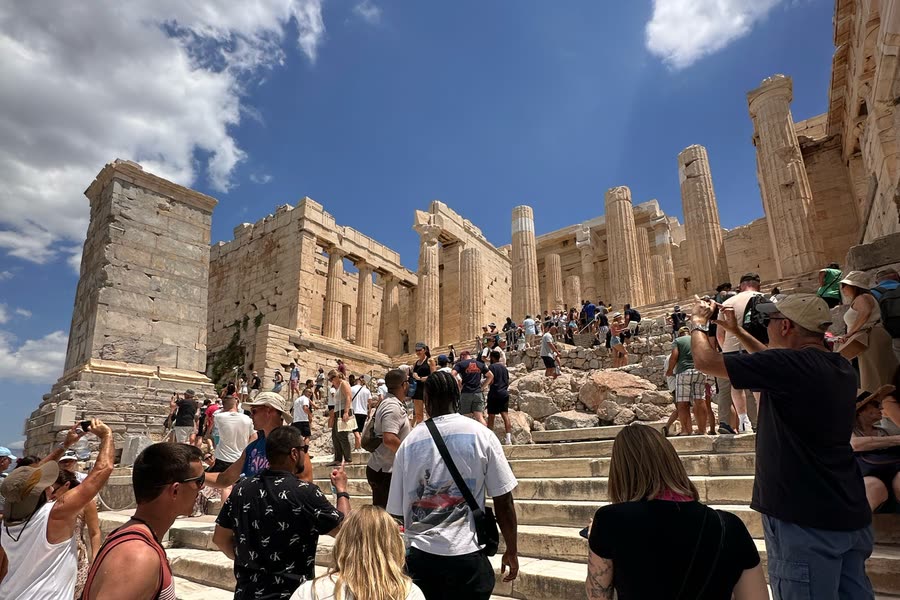 The group climbing the steps to the Acropolis in Athens, the Propylaea columns above them